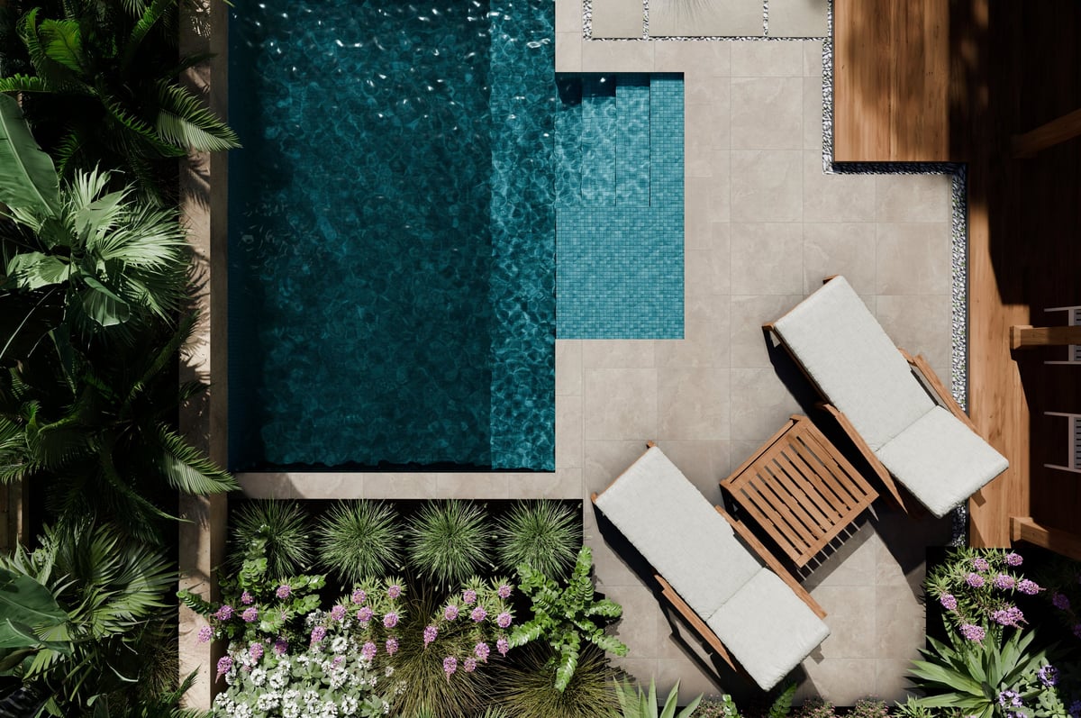 Aerial view of luxury swimming pool design and garden landscaping with modern beach house architecture and tropical palms
